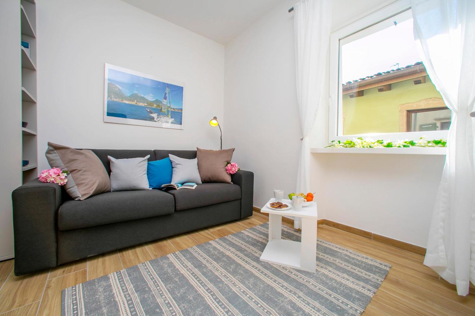 Nido Sui Tetti Di Riva Del Garda - Happy Rentals 外观 照片