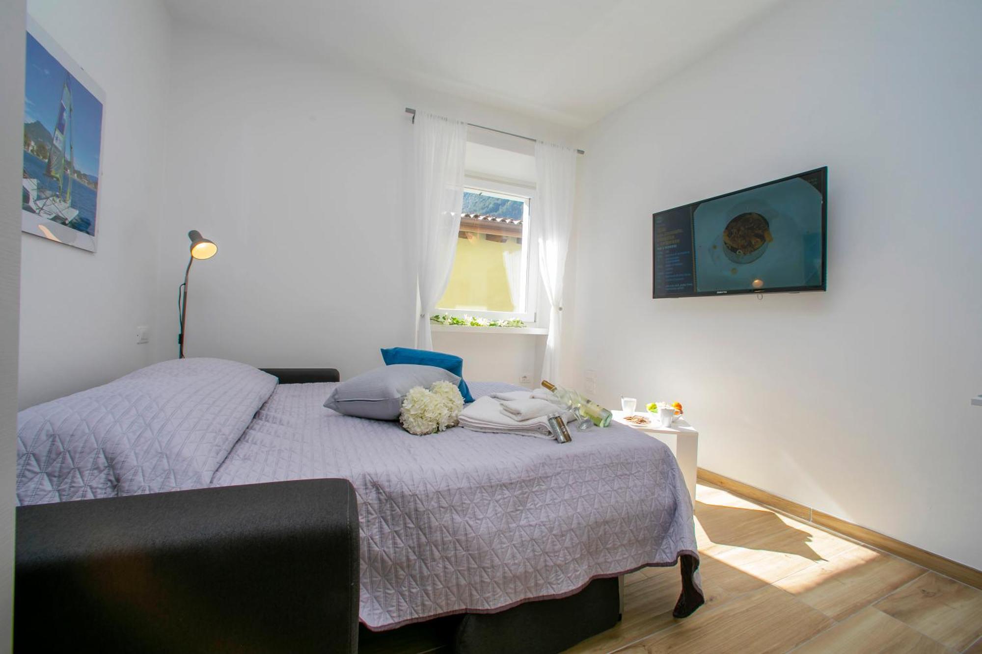 Nido Sui Tetti Di Riva Del Garda - Happy Rentals 外观 照片