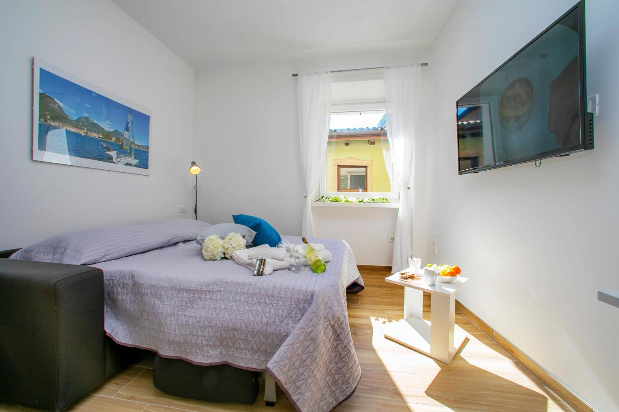 Nido Sui Tetti Di Riva Del Garda - Happy Rentals 外观 照片